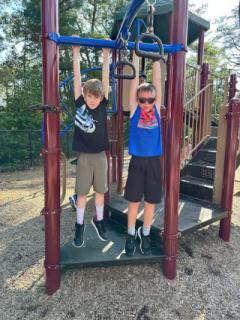 After School Program - Two Boys Playing on Play Structure